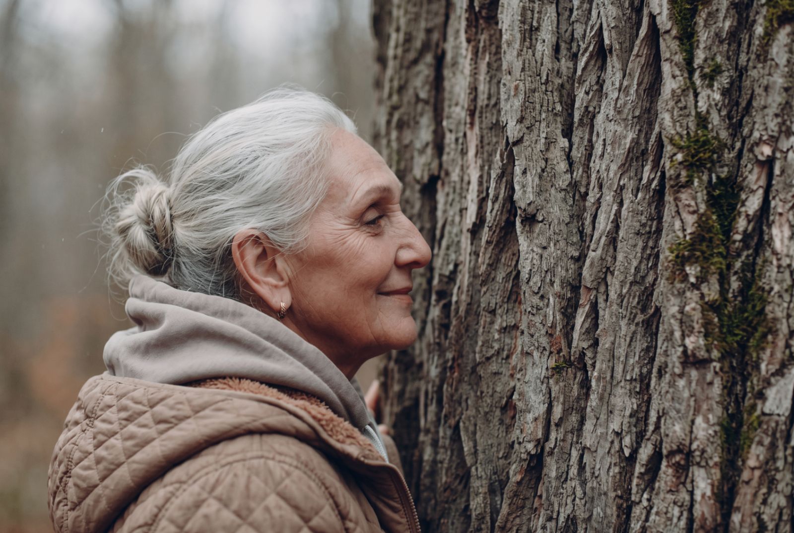 An older woman in profile, quiet and present in the mist — age as landscape